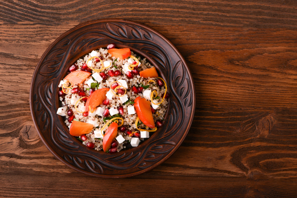 Insalata di quinoa, melograno e cachi
