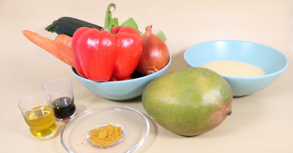 Ingredienti per la ricetta: mango, cous cous, verdure e curry